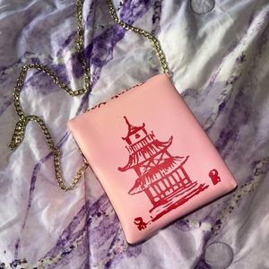 Pink bag with red lettering, never used and in great condition!